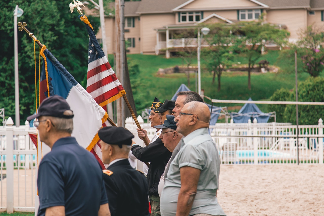 Men Standing Near US Flags